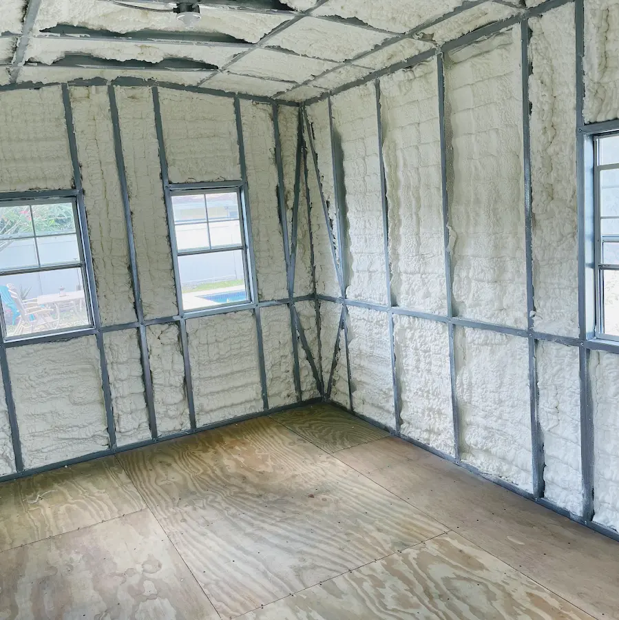 Closed-cell spray foam insulation applied to wall cavities in a residential project in Kill Devil Hills